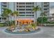 Terrace East entrance featuring a decorative water feature and lush landscaping creates a grand welcome at 5300 Ocean Blvd # 202, Sarasota, FL 34242