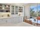 Dining area with white cabinets and natural light at 5300 Ocean Blvd # 202, Sarasota, FL 34242