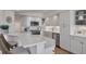 Bright kitchen featuring white cabinetry, stainless steel appliances, and sleek countertops at 5300 Ocean Blvd # 202, Sarasota, FL 34242