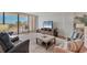 Bright living room with balcony access, offering stunning views of the ocean at 5300 Ocean Blvd # 202, Sarasota, FL 34242