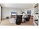 Inviting living room with comfortable seating and a view of the beach from the balcony at 5300 Ocean Blvd # 202, Sarasota, FL 34242