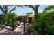 Sun Garden Cafe entrance with lush landscaping and an inviting outdoor seating area for breakfast and lunch at 5300 Ocean Blvd # 202, Sarasota, FL 34242