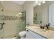Elegant bathroom featuring a glass-enclosed shower, quartz countertops, and modern fixtures at 5329 Trails Bend Ct, Sarasota, FL 34238