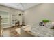 Bright bedroom with a plush bed, wooden floors, and vanity area, offering a cozy and inviting space at 5329 Trails Bend Ct, Sarasota, FL 34238