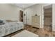Cozy bedroom with wood flooring, ensuite bathroom, and closet providing ample storage and convenience at 5329 Trails Bend Ct, Sarasota, FL 34238
