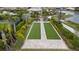 Gorgeous aerial view of bocce ball court featuring pristine landscaping and surrounding walking paths at 5329 Trails Bend Ct, Sarasota, FL 34238