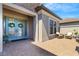 Inviting front entrance with double doors, brick pavers, stone accents, and a cozy seating area creates a warm welcome at 5329 Trails Bend Ct, Sarasota, FL 34238