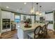 Bright kitchen boasts granite countertops, stainless steel appliances, pendant lights, and hardwood floors at 5329 Trails Bend Ct, Sarasota, FL 34238