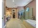 Gorgeous bathroom features a large walk-in shower, a separate tub, dual sinks, and a walk-in closet at 5329 Trails Bend Ct, Sarasota, FL 34238