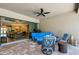 Covered patio with comfortable seating, perfect for enjoying outdoor living and access to the interior at 5329 Trails Bend Ct, Sarasota, FL 34238