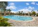 Resort-style pool with lane markers, lounge chairs, cabana and beautiful landscaping for a relaxing environment at 5329 Trails Bend Ct, Sarasota, FL 34238