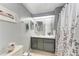 Neutral bathroom with gray walls, decorative accents, and a gray vanity at 5619 Bayshore Rd # 423, Palmetto, FL 34221