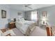 Comfortable bedroom featuring palm tree decor, bedside tables, and a cozy chair near the window at 5619 Bayshore Rd # 423, Palmetto, FL 34221
