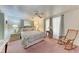 Serene bedroom featuring neutral tones, a ceiling fan, and soft natural light at 5619 Bayshore Rd # 423, Palmetto, FL 34221