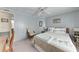 Stylish bedroom with a palm tree decor, chair, desk and an adjoining room on the left at 5619 Bayshore Rd # 423, Palmetto, FL 34221