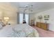 Bedroom with a floral arrangement on the dresser, rocking chair and a view of the window at 5619 Bayshore Rd # 423, Palmetto, FL 34221