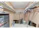 Walk-in closet with ample storage shelves and clothing racks, plus luggage and a mirror at 5619 Bayshore Rd # 423, Palmetto, FL 34221