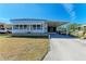 Bright single-story home with a carport and well-maintained lawn at 5619 Bayshore Rd # 423, Palmetto, FL 34221