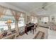 Inviting living room with large windows, piano, and comfortable daybed at 5619 Bayshore Rd # 423, Palmetto, FL 34221