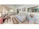 Cozy living room featuring a piano, comfortable seating, and ample natural light at 5619 Bayshore Rd # 423, Palmetto, FL 34221