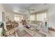 Comfortable living room features a ceiling fan and an open floor plan leading to a bedroom at 5619 Bayshore Rd # 423, Palmetto, FL 34221