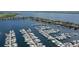 Aerial view of marina with an abundance of boats docked on the water at 611 Riviera Dunes Way # 107, Palmetto, FL 34221