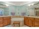 Spacious bathroom featuring a large soaking tub, dual vanities, and elegant finishes at 611 Riviera Dunes Way # 107, Palmetto, FL 34221