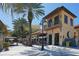 Charming building with outdoor seating, perfect for enjoying the beautiful surroundings and dining al fresco at 611 Riviera Dunes Way # 107, Palmetto, FL 34221