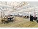 Bright ballroom features elegant chandeliers, coffered ceilings, and ample space for dining and events at 6602 Peach Tree Creek Rd, Bradenton, FL 34203