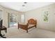 Bedroom with neutral walls, sliding glass door to pool area, and fan at 6602 Peach Tree Creek Rd, Bradenton, FL 34203