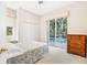 Cozy bedroom features a pool view, closet, and window seat for lounging at 6602 Peach Tree Creek Rd, Bradenton, FL 34203