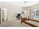 Comfortable bedroom featuring neutral walls, carpet floors, and access to the pool area at 6602 Peach Tree Creek Rd, Bradenton, FL 34203