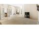 View of the living room showcasing neutral colors and tiled flooring at 6602 Peach Tree Creek Rd, Bradenton, FL 34203