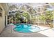 Backyard pool with screened enclosure at 6602 Peach Tree Creek Rd, Bradenton, FL 34203
