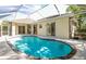 View of backyard pool with screened enclosure at 6602 Peach Tree Creek Rd, Bradenton, FL 34203