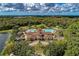 Stunning aerial view featuring a clubhouse, pools, and lush landscaping, perfect for recreation and relaxation at 7278 Lismore Ct, Lakewood Ranch, FL 34202