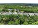 Beautiful aerial shot showcasing this house surrounded by mature trees and lush landscaping at 7278 Lismore Ct, Lakewood Ranch, FL 34202