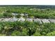 Beautiful aerial shot showcasing this house surrounded by mature trees and lush landscaping at 7278 Lismore Ct, Lakewood Ranch, FL 34202