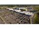 Aerial view of a shopping center featuring retail stores and ample parking, perfect for convenient shopping at 7278 Lismore Ct, Lakewood Ranch, FL 34202