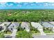 Overhead view of a suburban home surrounded by lush greenery and neighboring residences, showcasing its location at 7278 Lismore Ct, Lakewood Ranch, FL 34202