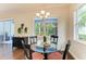 Eat-in kitchen and dining area with natural light and view of the patio at 7278 Lismore Ct, Lakewood Ranch, FL 34202