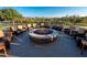 Outdoor fire pit surrounded by chairs, perfect for entertaining on cool evenings, with a beautiful view at 7278 Lismore Ct, Lakewood Ranch, FL 34202