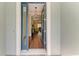 Warm foyer featuring hardwood floors and an open doorway that leads into the elegantly designed interior spaces at 7278 Lismore Ct, Lakewood Ranch, FL 34202