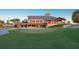 Well-manicured golf course featuring the clubhouse in the background at 7278 Lismore Ct, Lakewood Ranch, FL 34202