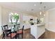 Open kitchen featuring a breakfast nook with a glass table and access to modern appliances at 7278 Lismore Ct, Lakewood Ranch, FL 34202