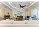 Spacious living room boasts modern decor, tray ceiling, and easy access to the outdoor area at 7278 Lismore Ct, Lakewood Ranch, FL 34202