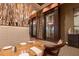 Cozy restaurant dining space with a custom wine cellar and intimate table settings at 7278 Lismore Ct, Lakewood Ranch, FL 34202