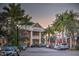 A scenic street view surrounded by shops, restaurants, and lush tropical palm trees at 7278 Lismore Ct, Lakewood Ranch, FL 34202