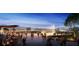 Vibrant town center with modern buildings, a beautiful fountain, and people enjoying the outdoor space at 7278 Lismore Ct, Lakewood Ranch, FL 34202