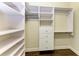 Organized walk-in closet with built-in shelving, drawers, and clothing rods for efficient storage solutions at 7278 Lismore Ct, Lakewood Ranch, FL 34202